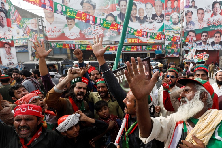 People chant slogans as they condemn the shooting incident on a long march held by Pakistan's former Prime Minister Imran Khan, in Wazirabad