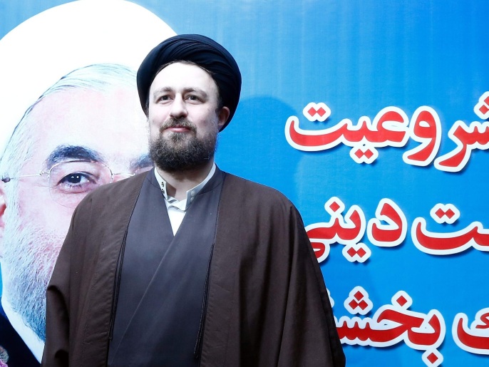 (FILE) A file photo dated 18 December 2015 showing Iranian Hassan Khomeini, the grandson of late Iranian supreme leader Ayatollah Ruhollah Khomeini, standing next to a poster of Iranian President Hassan Rowhani, as he arrives to registers his candidacy at the Interior Ministry during the registration for Iran's upcoming election for Assembly of Experts, in Tehran, Iran. Khomeini, a grandson of late Iranian revolutionary leader ayatollah Ruhollah Khomeini has reportedly been disqualified from next month's parliamentary elections media reports state 26 January 2016. Hassan Khomeini, 43, and believed to be reform-oriented was seeking election to the Council of Experts on February 26. But his son Ahmad posted on Instagram that Hassan had been disqualified. There was no official confirmation of the news. Hassan is the most prominent among the late ayatollah's 15 grandchildren.