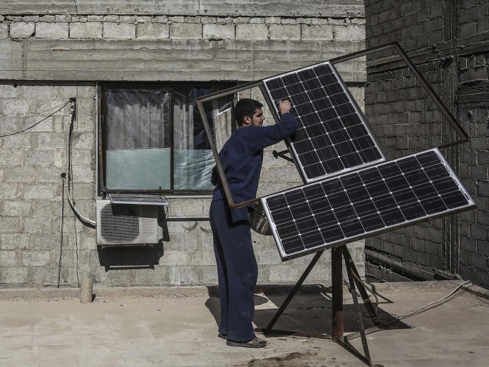 A Syrian man cleans a solar panel in the rebel-held city of Douma, outside Damascus, Syria, 05 February 2016. Syria's eastern Al-Ghouta province has been widely cut off from the power grid with solar panels being the only reliable source for electricity.