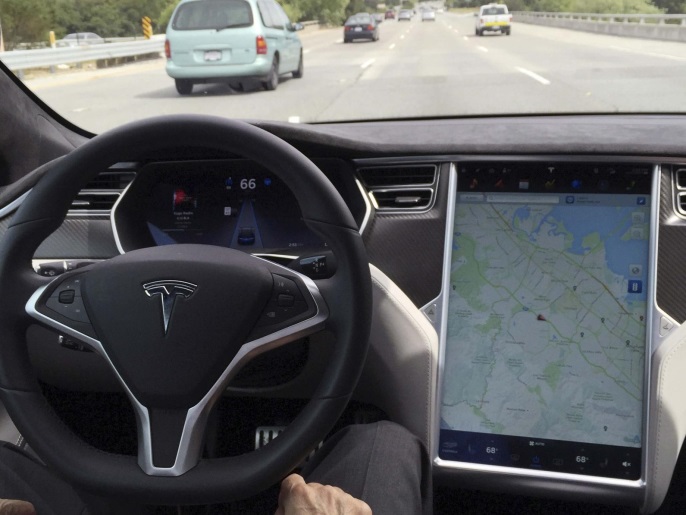 The interior of a Tesla Model S is shown in autopilot mode in San Francisco, California, U.S., April 7, 2016. REUTERS/Alexandria Sage/File Photo